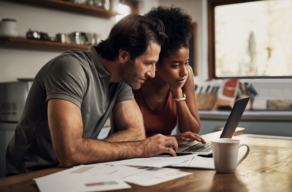 Couple looking at a laptop